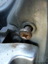 Changing_rear_bulb_on_zt-t_rusty_broken_rivet.JPG